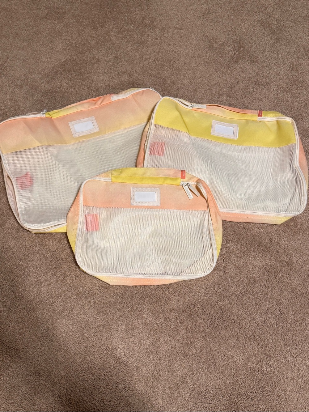 Calpak Mesh Travel Packing Cubes in Pastel Yellow & Peach
